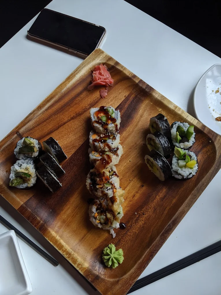 Sushi roll platter served on a wood board at Kimchi Sushi, Keewatin Street, Winnipeg